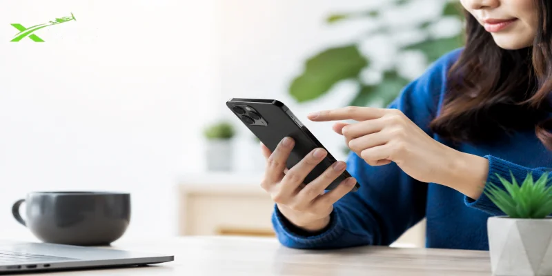 A user entering registration details on a mobile device to initiate the X555 Create New Account process.